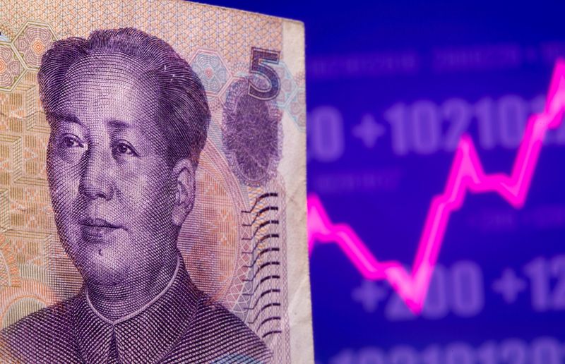 &copy; Reuters. A Chinese Yuan banknote is seen in front of displayed stock graph in this illustration taken May 7, 2021. REUTERS/Dado Ruvic/Illustration