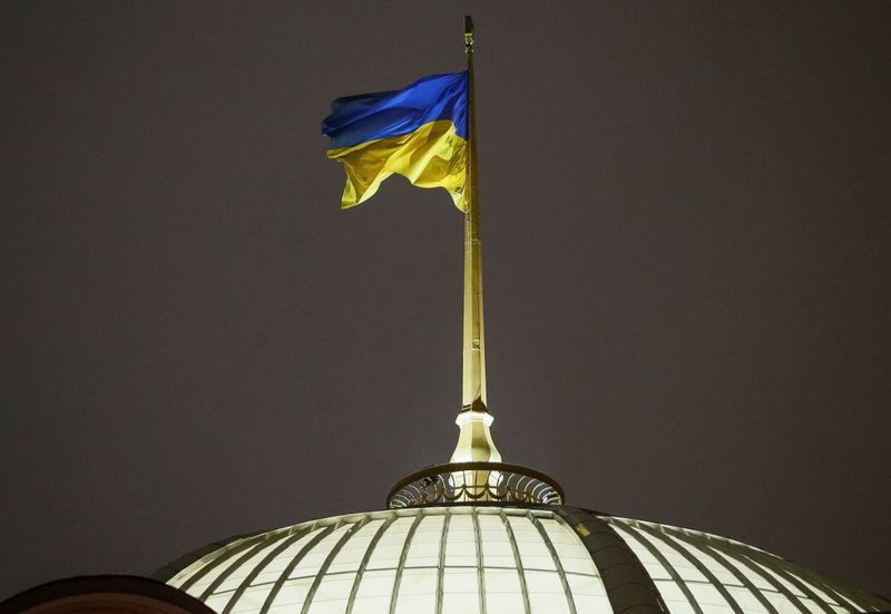 &copy; Reuters. A Ukrainian national flag flies over the parliament building (Verkhovna Rada) during a parliament session to review a proposal by President Petro Poroshenko to introduce martial law for 60 days after Russia seized Ukrainian naval ships off the coast of Ru