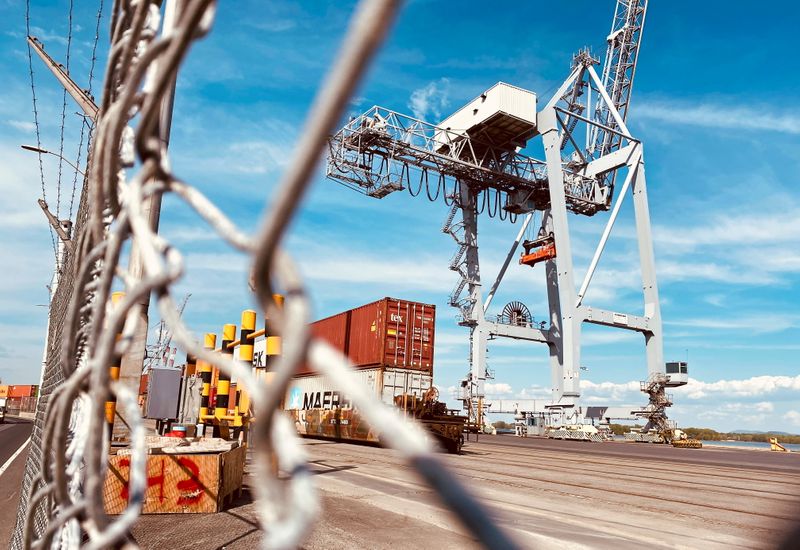 &copy; Reuters. FILE PHOTO: Shipping containers are seen behind fencing in the Port of Montreal in Montreal, Quebec, Canada, May 17, 2021.  REUTERS/Christinne Muschi/File Photo