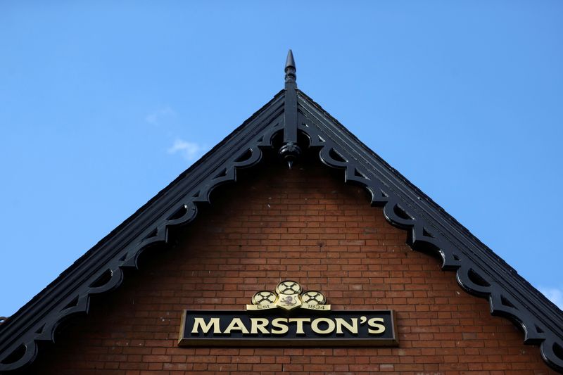 © Reuters. FILE PHOTO: A view shows a Marston's pub logo, following new restrictions to curb the spread of the coronavirus disease (COVID-19) infections, in Shobnall, in Burton-on-Trent, Britain October 15, 2020. REUTERS/Carl Recine/File Photo