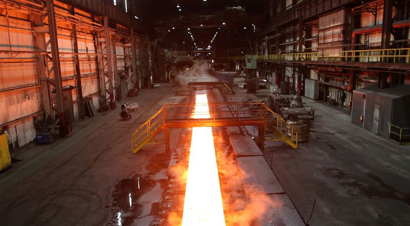 &copy; Reuters. FILE PHOTO: Steam rolls off a slab of steel as it rolls down the line at the Novolipetsk Steel PAO steel mill in Farrell, Pennsylvania, U.S., March 9, 2018. REUTERS/Aaron Josefczyk