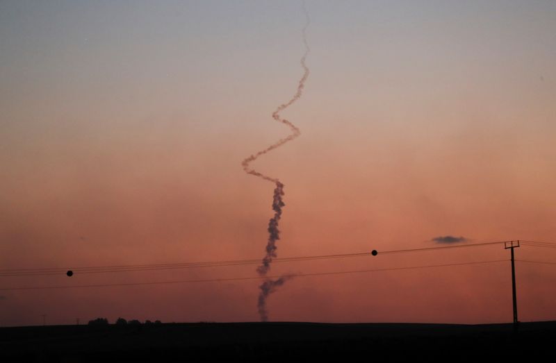 &copy; Reuters. A Gaza. Un haut responsable du Hamas a prédit un cessez-le-feu dans les jours à venir, alors que les affrontements entre Israël et les factions armées palestiniennes de Gaza font rage depuis le 10 mai. /Photo prise le 19 mai 2021/REUTERS/Ammar Awad