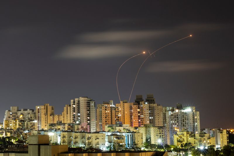 &copy; Reuters. Streaks of light are seen as Israel's Iron Dome anti-missile system intercepts rockets launched from the Gaza Strip towards Israel, as seen from Ashkelon May 20, 2021 REUTERS/ Amir Cohen