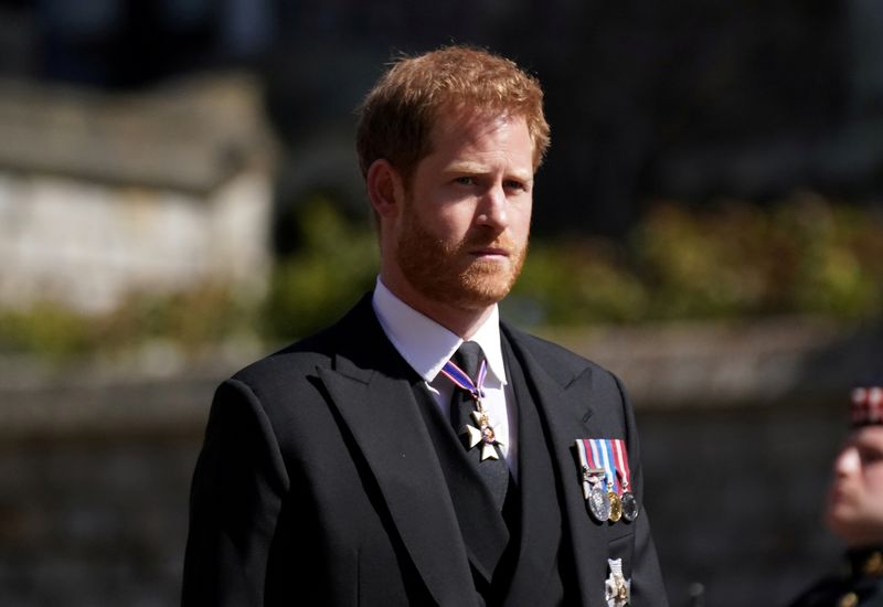 &copy; Reuters. FILE PHOTO: Britain's Prince Harry walking in the procession at Windsor Castle, Berkshire, during the funeral of Britain's Prince Philip, who died at the age of 99, Britain, April 17, 2021. Victoria Jones/Pool via REUTERS/File Photo