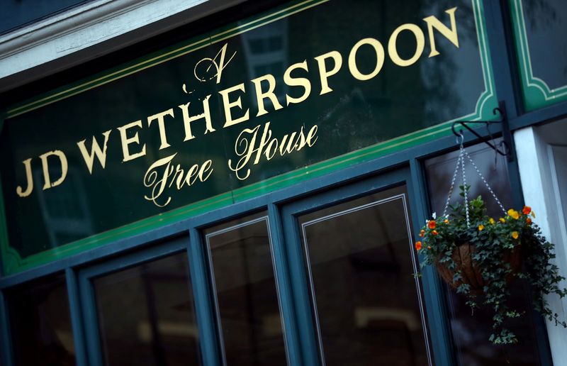 &copy; Reuters. FILE PHOTO: A Wetherspoon's logo is seen at a pub in central London, Britain January 23, 2019. REUTERS/Hannah McKay