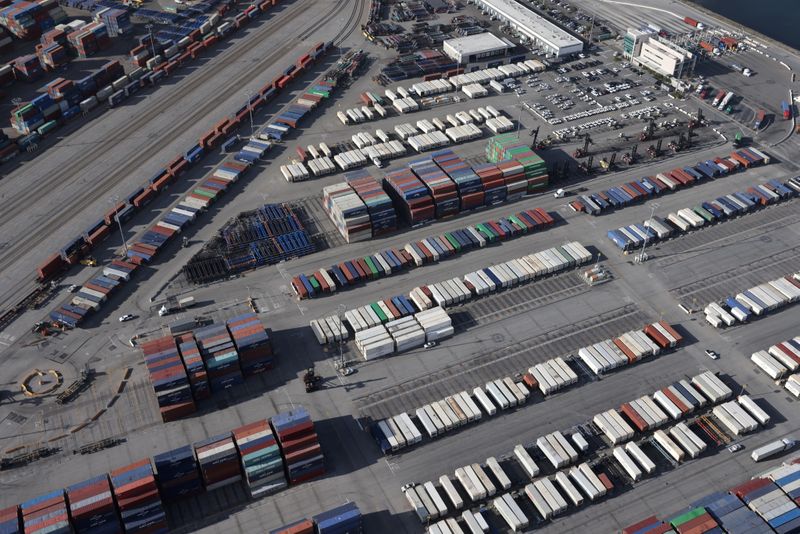 &copy; Reuters. FILE PHOTO: Shipping containers sit on the dock at a container terminal at the Port of Long Beach-Port of Los Angeles complex, amid the coronavirus disease (COVID-19) pandemic, in Los Angeles, California, U.S., April 7, 2021. REUTERS/Lucy Nicholson/File P