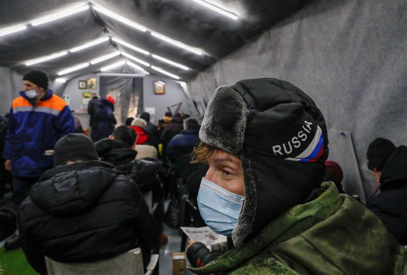 &copy; Reuters. People gather in the Rescue Shelter, which was opened by the Orthodox charity organisation Miloserdie to provide services to the homeless, in Moscow, Russia February 16, 2021. Picture taken February 16, 2021. REUTERS/Evgenia Novozhenina