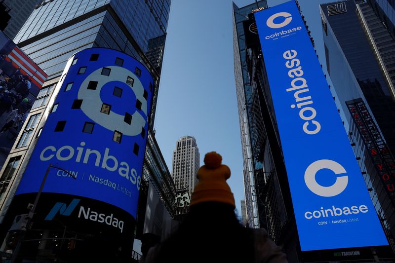 &copy; Reuters. The logo for Coinbase Global Inc, the biggest U.S. cryptocurrency exchange, is displayed on the Nasdaq MarketSite jumbotron and others at Times Square in New York, U.S., April 14, 2021. REUTERS/Shannon Stapleton
