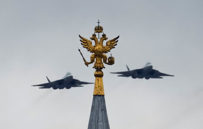 &copy; Reuters. Russian military aircraft fly in formation above the State Historical Museum during a flypast, which is part of a parade on Victory Day marking the 76th anniversary of the victory over Nazi Germany in World War Two, in central Moscow, Russia May 9, 2021. 