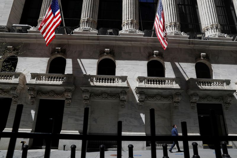 © Reuters. FILE PHOTO: A trader walks outside the New York Stock Exchange in New York City, U.S., April 26, 2021. REUTERS/Shannon Stapleton