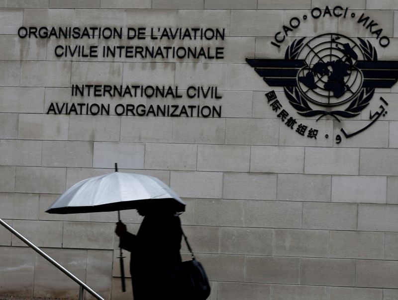 &copy; Reuters. FILE PHOTO: A pedestrian walks past the International Civil Aviation Organization (ICAO) headquarters building in Montreal, Quebec, Canada June 16, 2017.  REUTERS/Christinne Muschi/File Photo