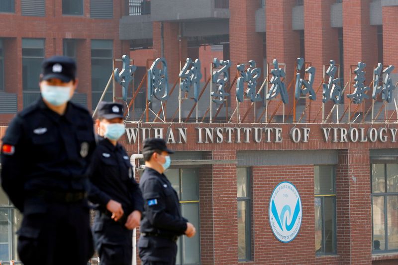 &copy; Reuters. FILE PHOTO: FILE PHOTO: Security personnel keep watch outside the Wuhan Institute of Virology during the visit by the World Health Organization (WHO) team tasked with investigating the origins of the coronavirus disease (COVID-19), in Wuhan, Hubei provin