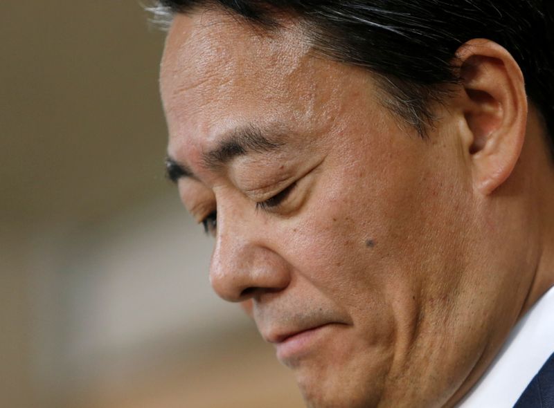 © Reuters. FILE PHOTO: Japan's main opposition Democratic Party of Japan (DPJ) leader Banri Kaieda attends a news conference at the DPJ headquarters as he announces his resignation as the party leader in Tokyo December 15, 2014. REUTERS/Yuya Shino