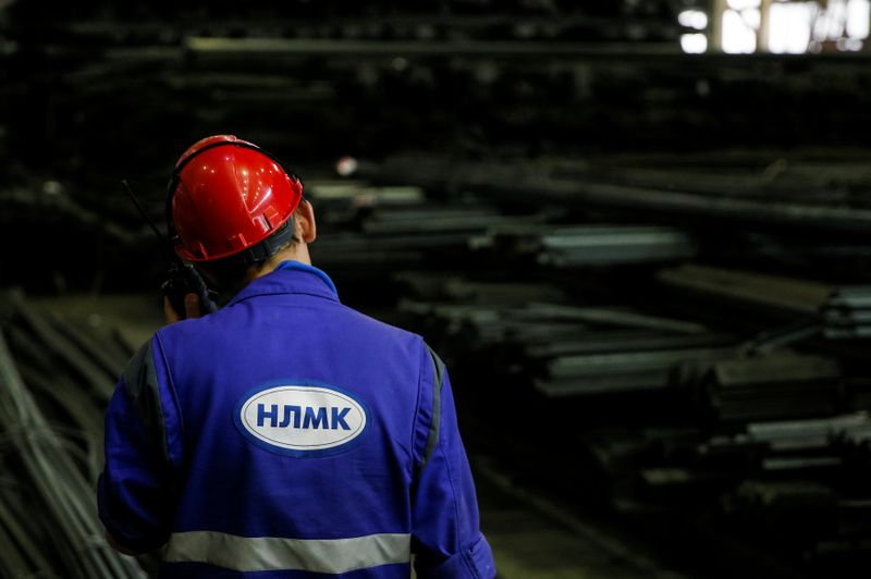 &copy; Reuters. An employee speaks on a walkie talkie at a warehouse of the NLMK Kaluga steel mill in Vorsino outside Kaluga, Russia, July 21, 2016. REUTERS/Maxim Shemetov