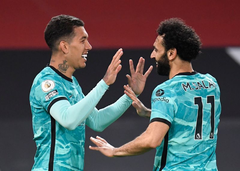 &copy; Reuters. Salah et Firmino ont porté Liverpool vers la victoire /Photo prise le 13 mai 2021/REUTERS/Peter Powell